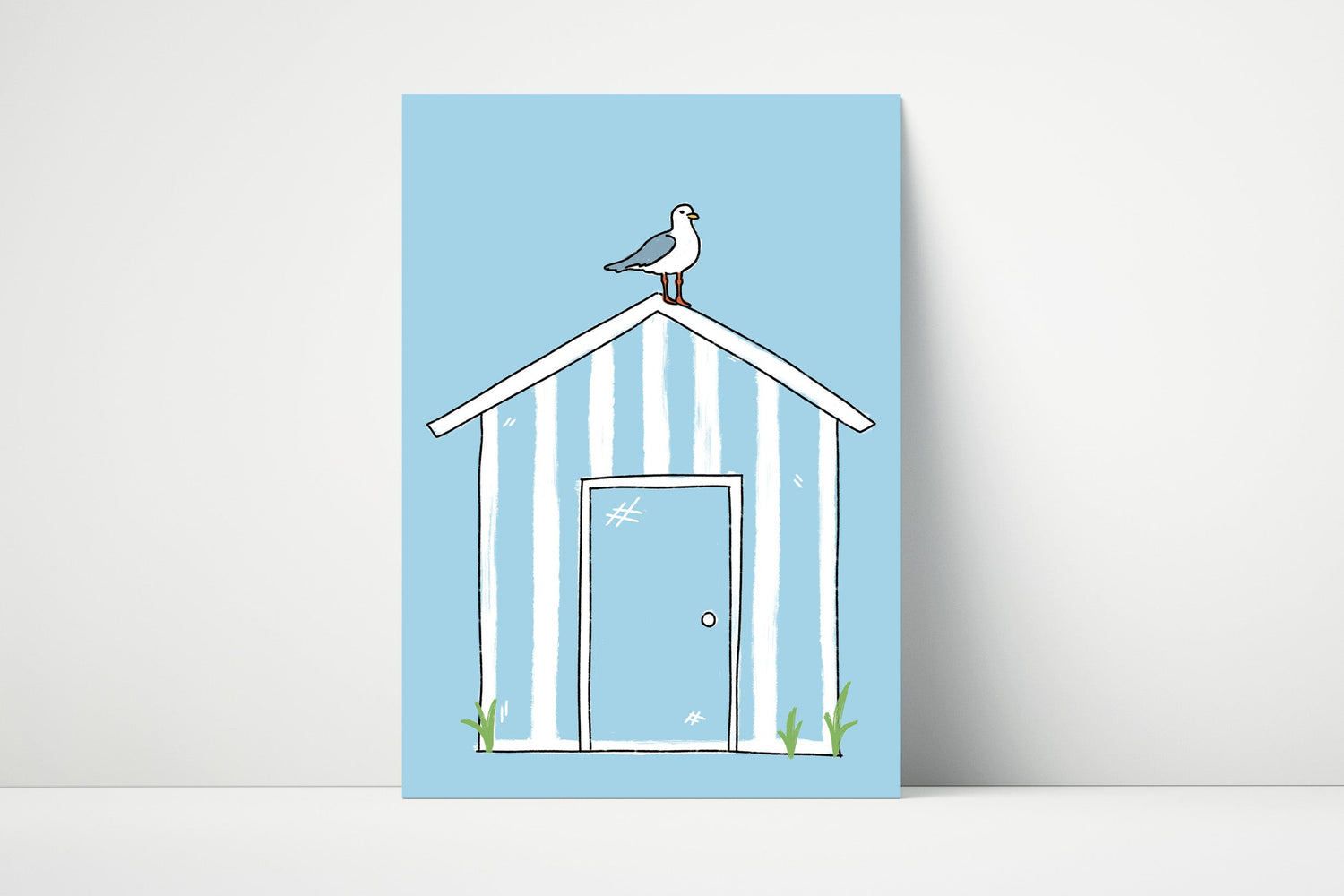 Hand drawn illustration of a striped beach hut with a seagull on top on a blue background, coastal themed wall art. 