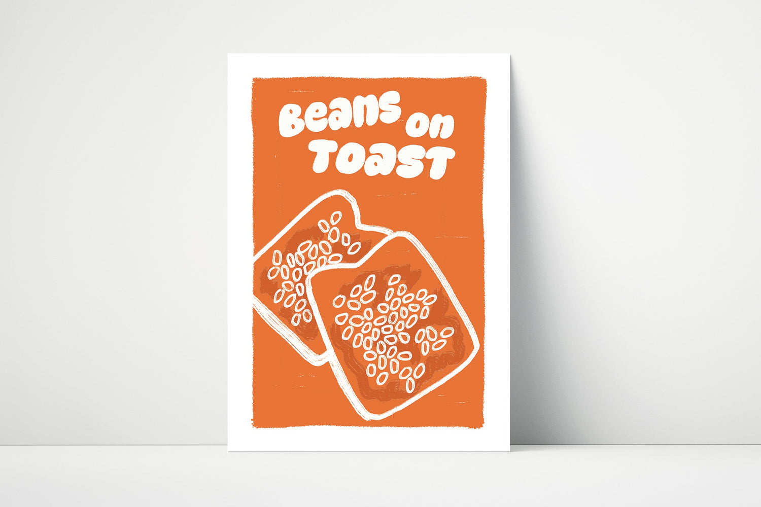 Matte paper print with 'Beans on Toast' text and a beans on toast illustration on an orange background.