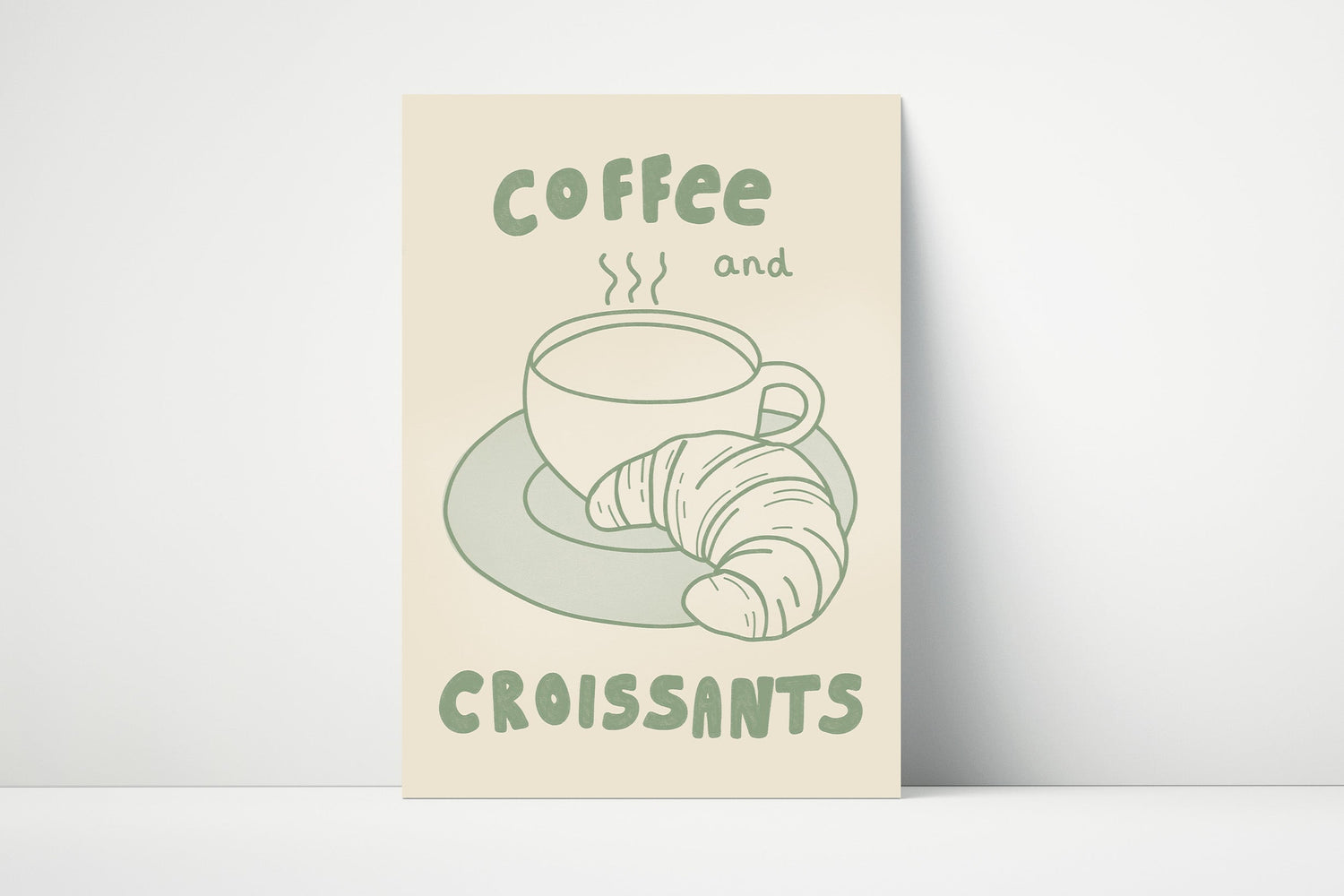 Off white print with a design of a coffee cup and croissant, text 'Coffee and Croissants', on matte paper.