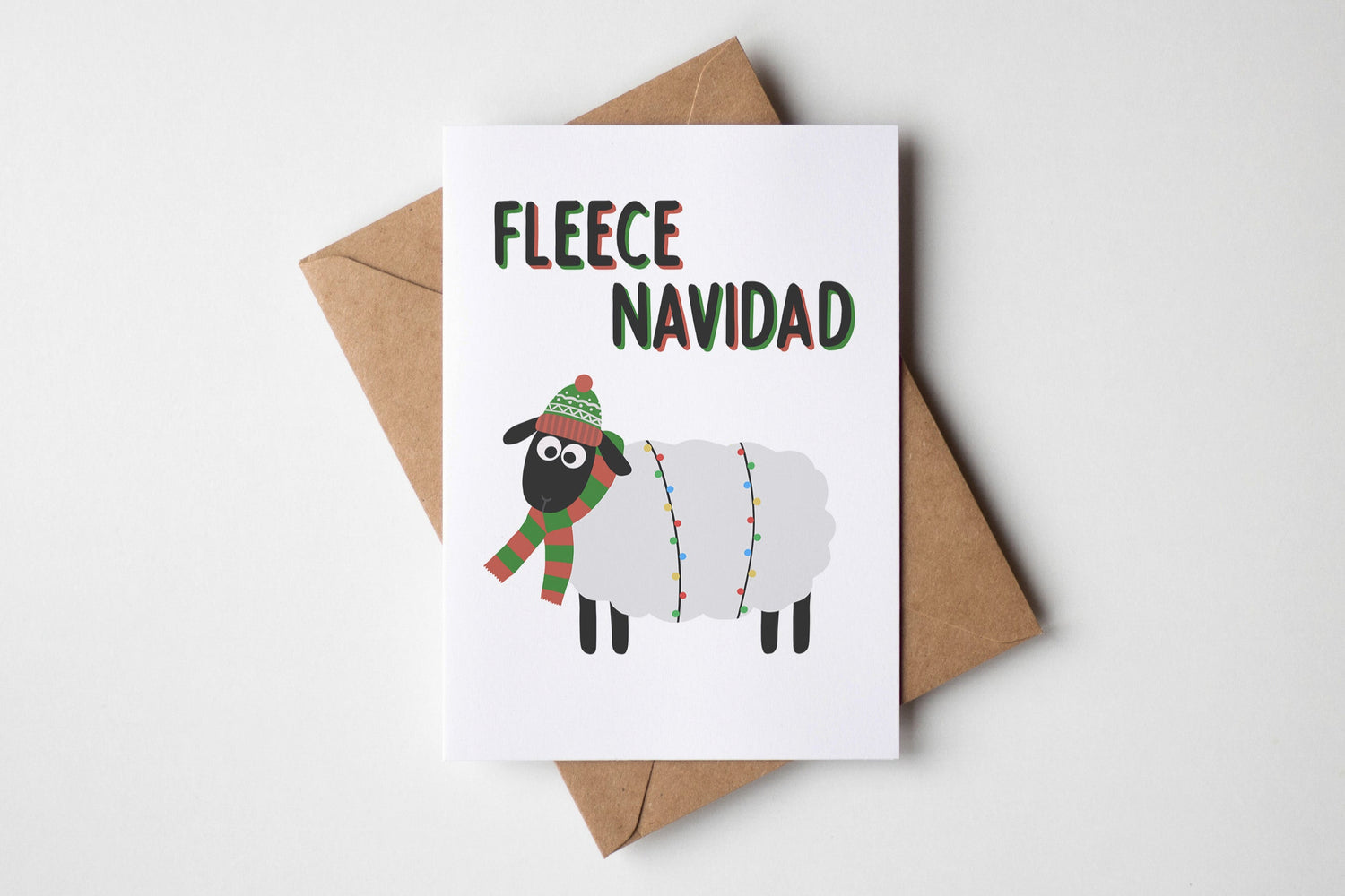 Card with a sheep illustration and 'Fleece Navidad' text on a white background