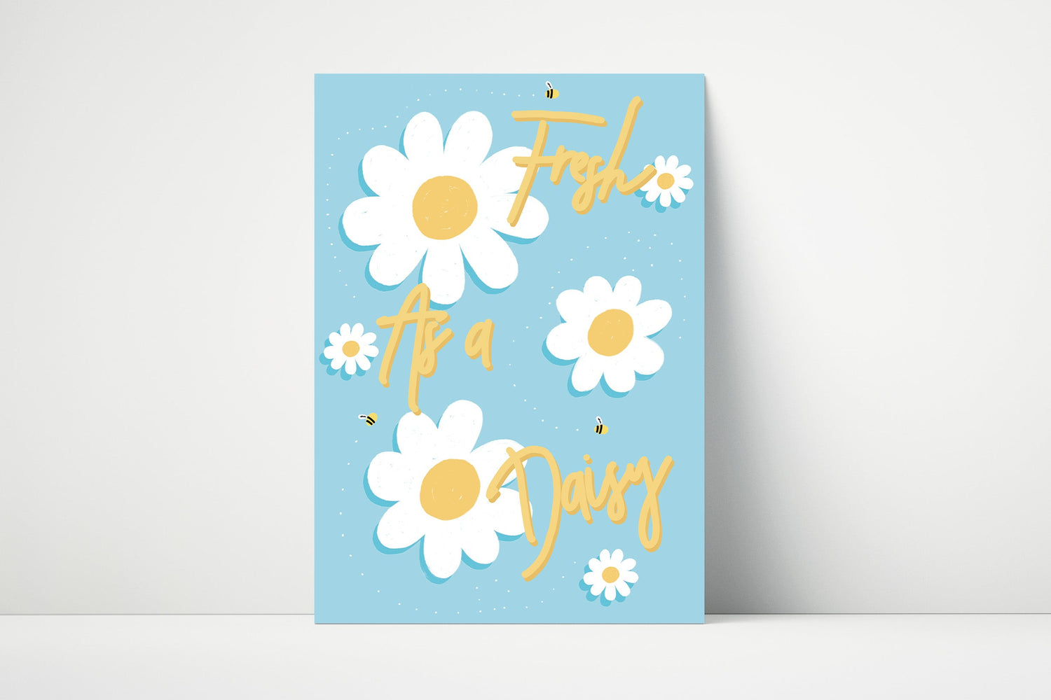Blue typography print with illustrated white daisy flowers and the phrase "fresh as a daisy", suitable for bathroom decor. 