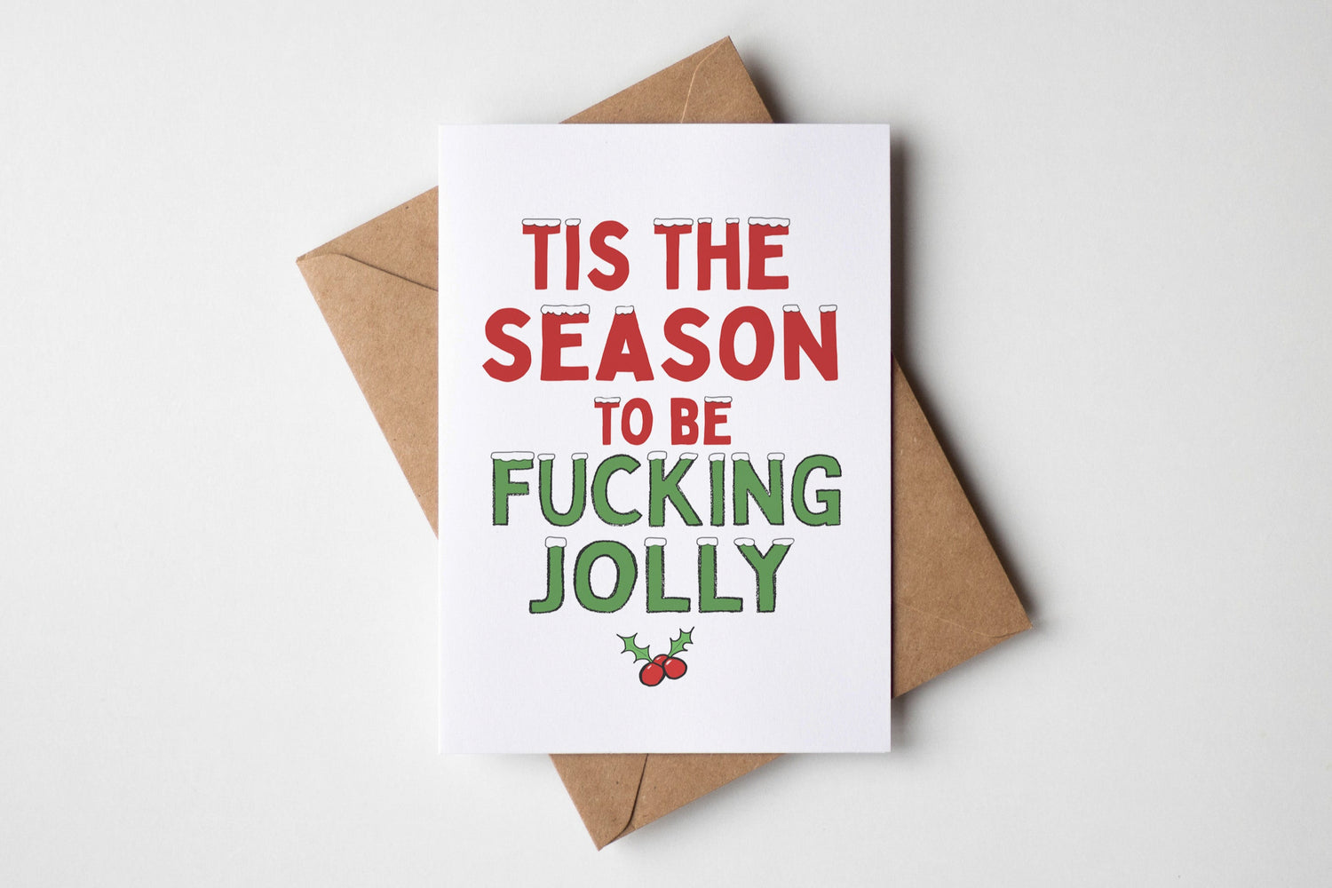 Card with 'Tis the season to be fucking jolly' text on a white background
