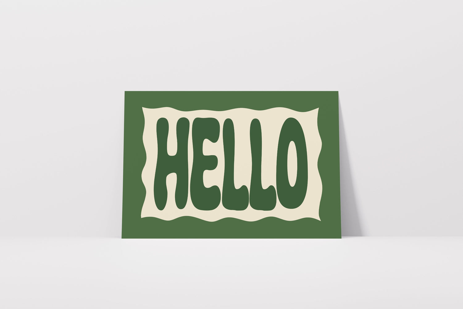 Print with bold green 'HELLO' text on an off white background with a green border.