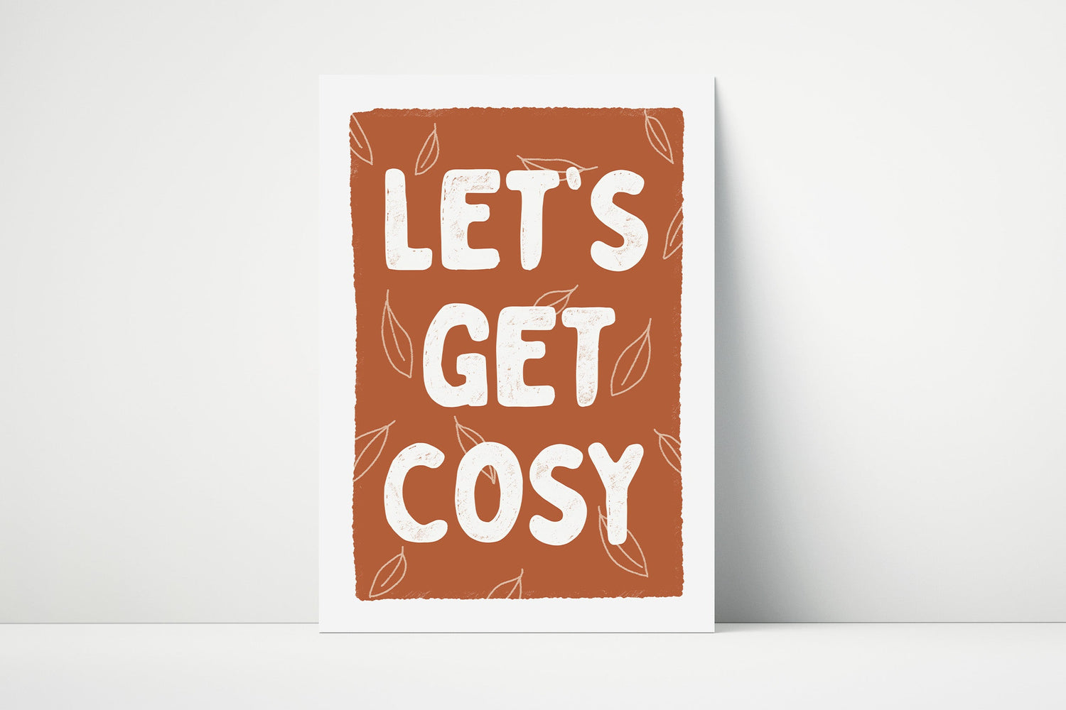 Deep orange brown print with 'LET'S GET COSY' text with a white border.