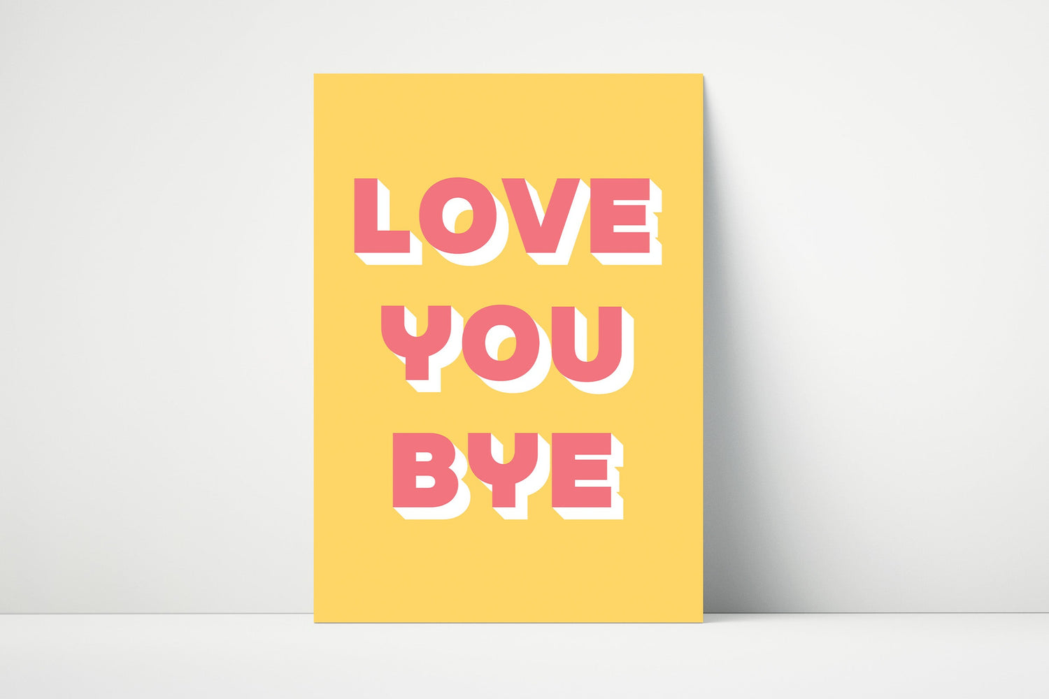 Bold typography print with the phrase "Love You Bye" in pink or yellow on matte paper. 