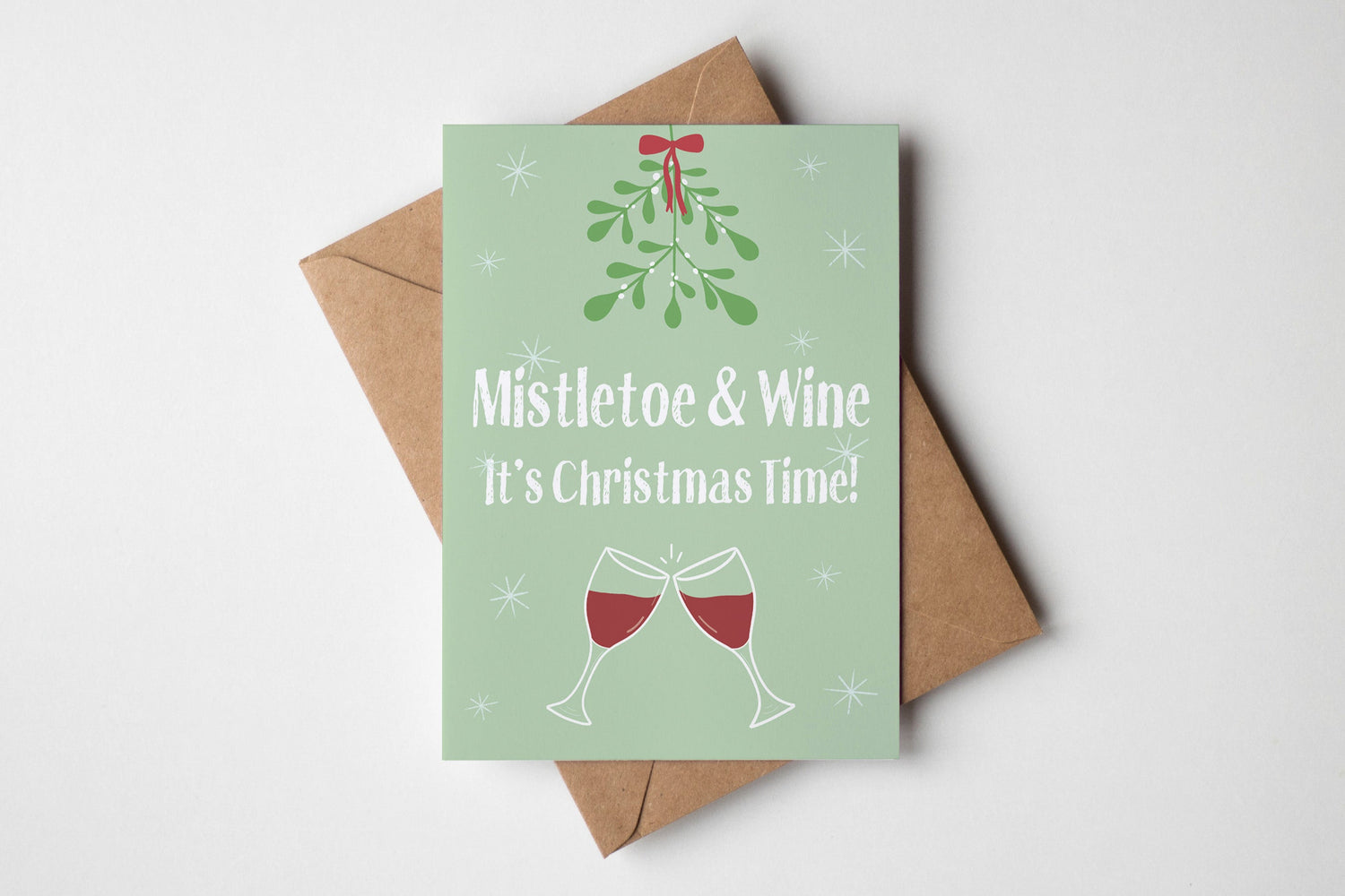 Christmas card with 'Mistletoe & Wine, It's Christmas Time!' text and wine glass illustrations on a light green background.