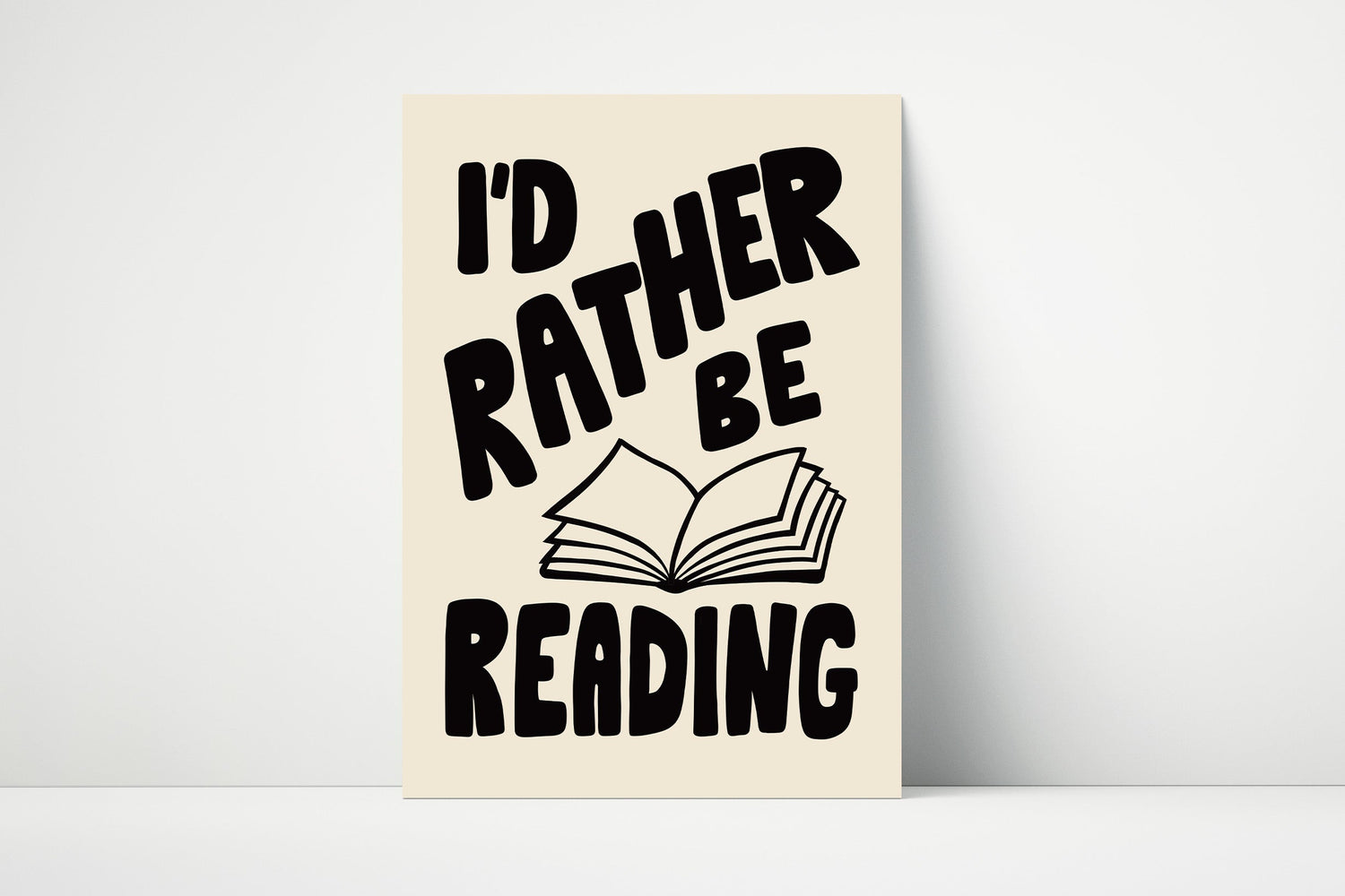 Wall art print with the phrase “I’d Rather Be Reading” in bold typography, perfect for book lovers and reading areas.
